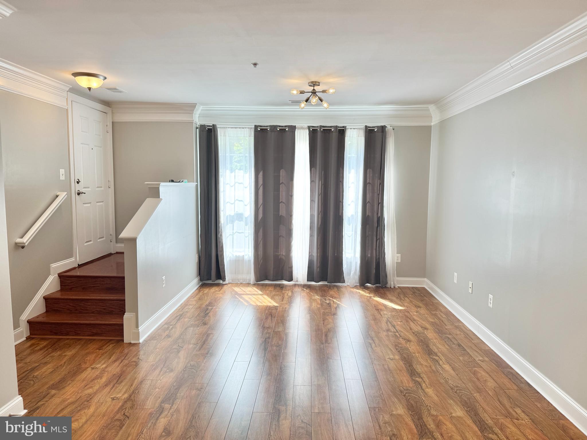2304 Margraf Circle Woodbridge, VA 22191 - Photo 4 of 27 a view of a room with wooden floor and stairs