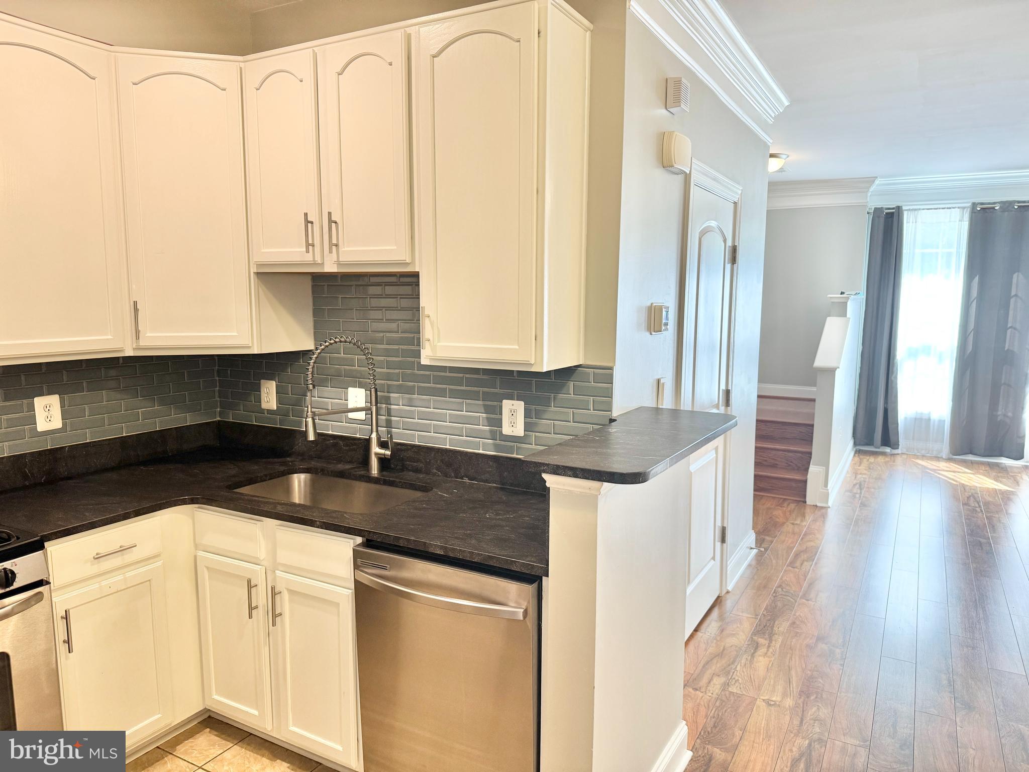 2304 Margraf Circle Woodbridge, VA 22191 - Photo 8 of 27 a kitchen with stainless steel appliances granite countertop a sink and cabinets
