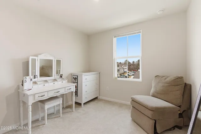 a bedroom with furniture and windows