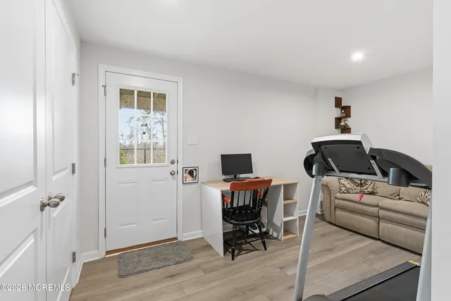 a workspace with furniture and wooden floor