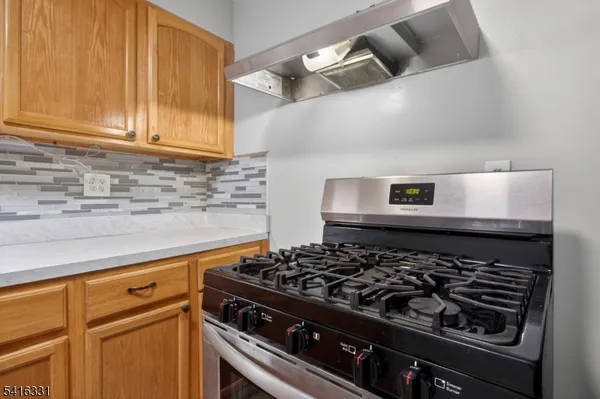 a close view of a stove top oven sitting inside of a kitchen