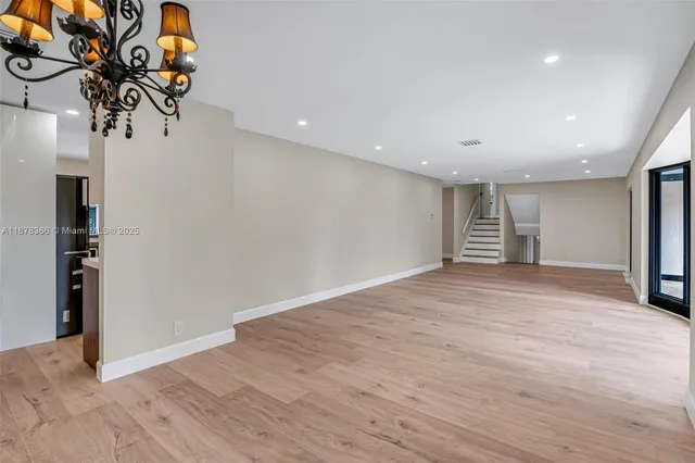 a view of a bathroom with a sink and a mirror