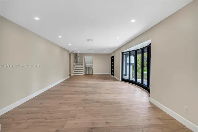 an aerial view of residential houses with yard