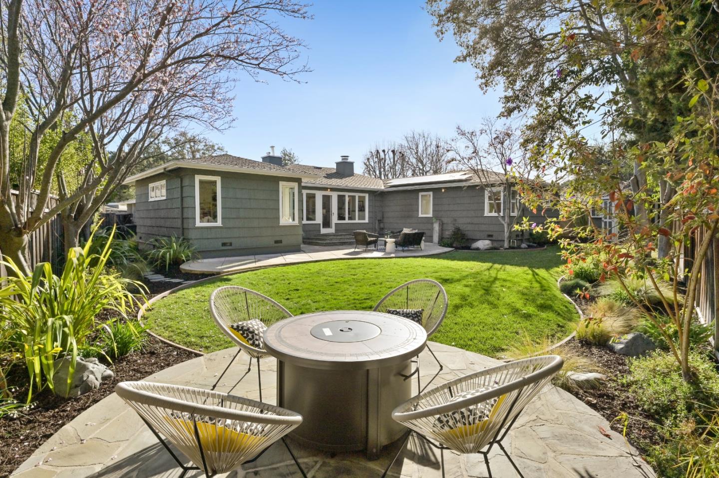 416 Stephen Road San Mateo, CA 94403 - Photo 8 of 11 a view of a chair and table in backyard of the house