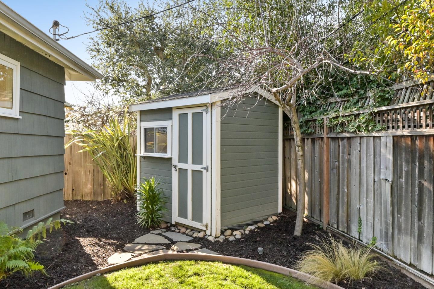 416 Stephen Road San Mateo, CA 94403 - Photo 9 of 11 a view of a backyard with plants and large tree