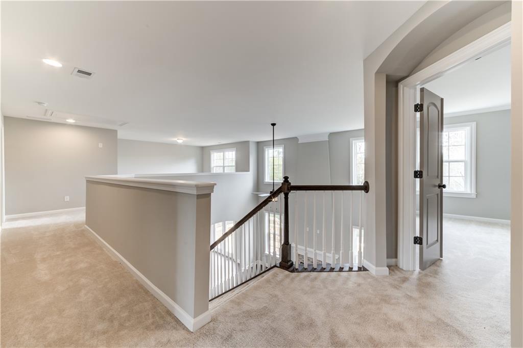 6145 Grindle Road Cumming, GA 30041 - Photo 14 of 20 a view of an empty room with a window