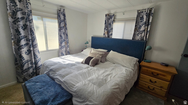 1500 Angel Street North, Unit 53 Layton, UT 84041 - Photo 12 of 20 Bedroom featuring white walls and a large window with horizontal blinds and decorative curtains