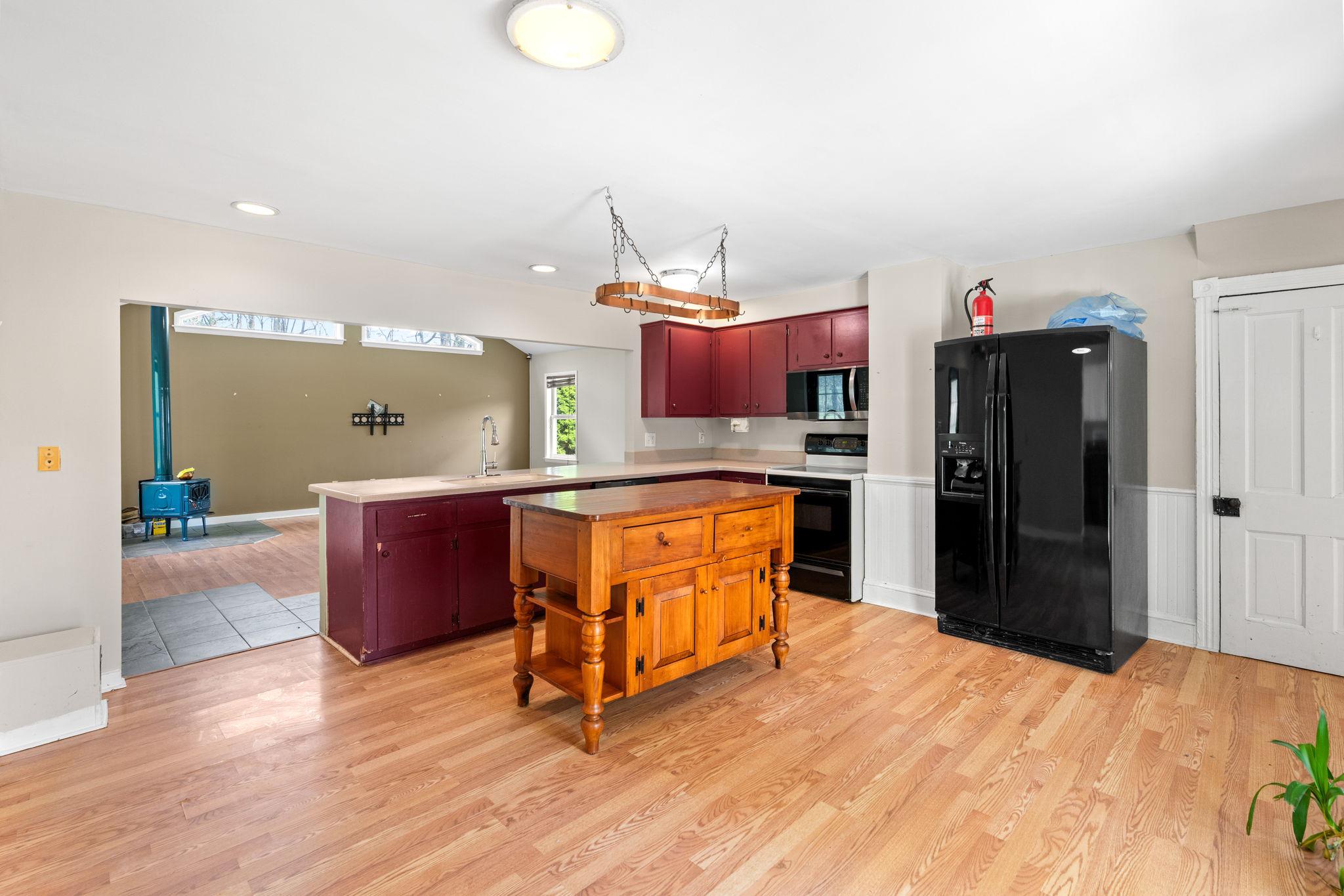 5002 Burkittsville Road Jefferson, MD 21755 - Photo 11 of 40 Kitchen Island and Pot Rack