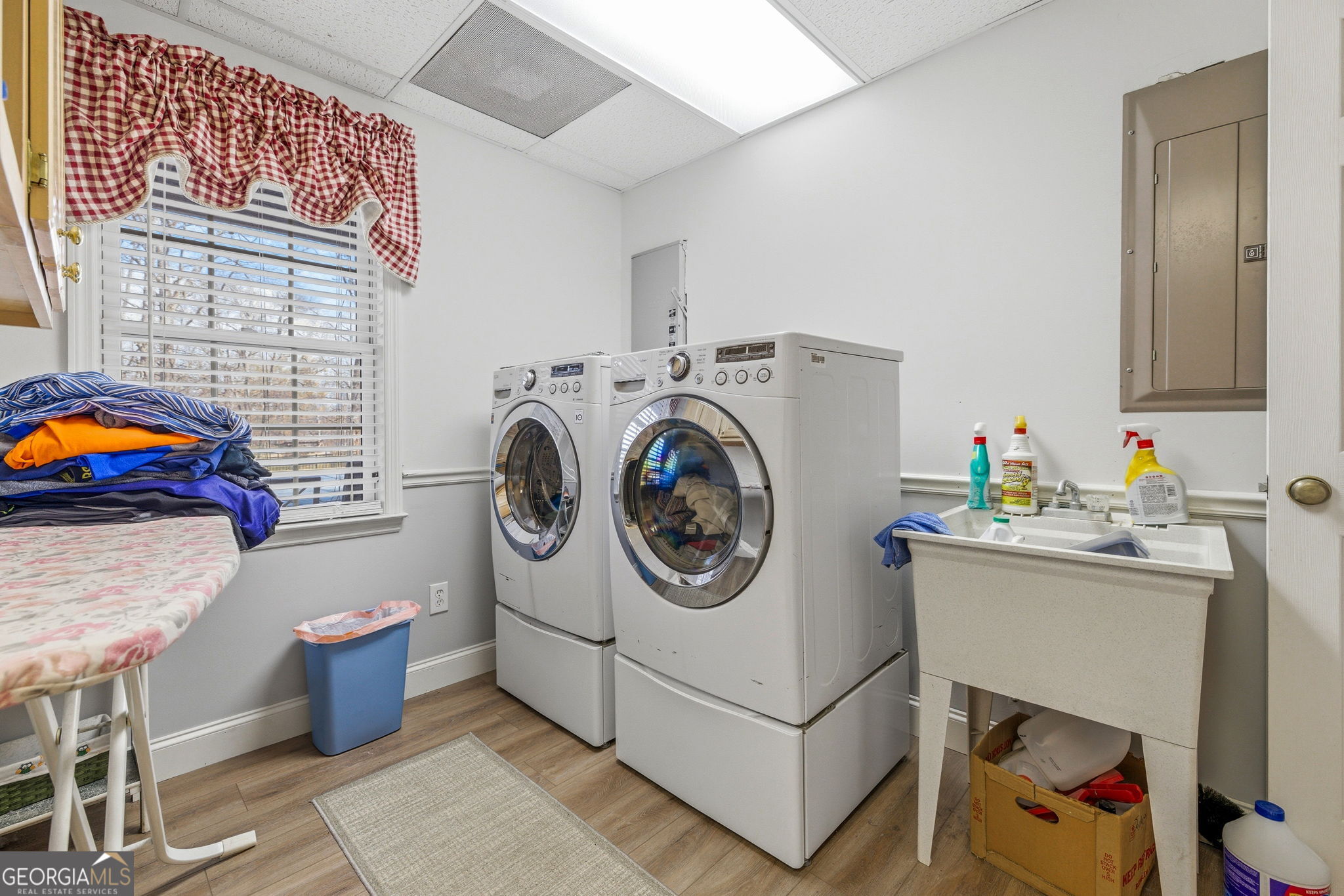 401 Herrin Road Cornelia, GA 30531 - Photo 36 of 83 a utility room with dryer washer and a view of living room