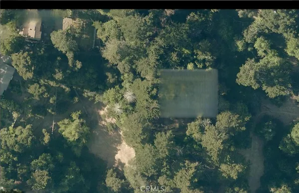 a backyard of a house with a yard with outdoor seating