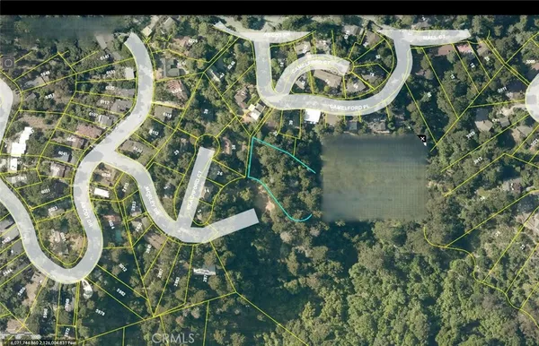 an aerial view of a highlighted house