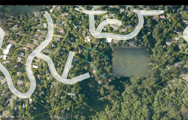 an aerial view of a highlighted house