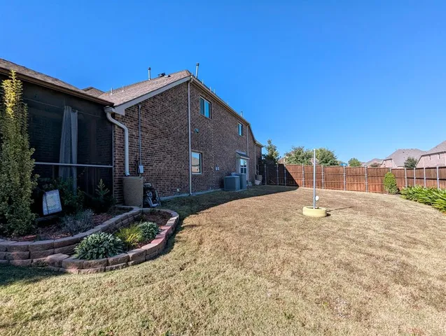 a view of a swimming pool with a yard