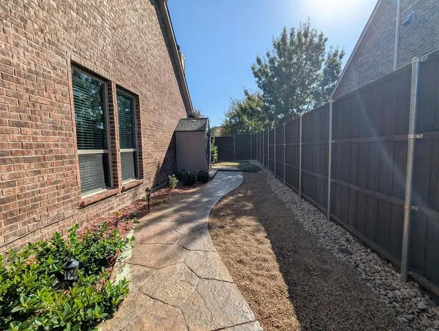 a view of a backyard of the house