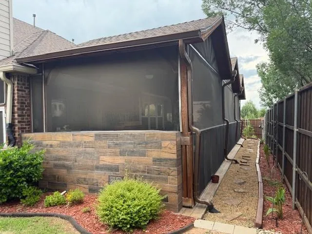 a view of house with wooden fence