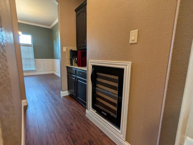 a view of kitchen and wooden floor