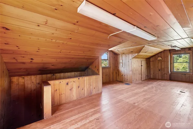 a view of a room with wooden walls