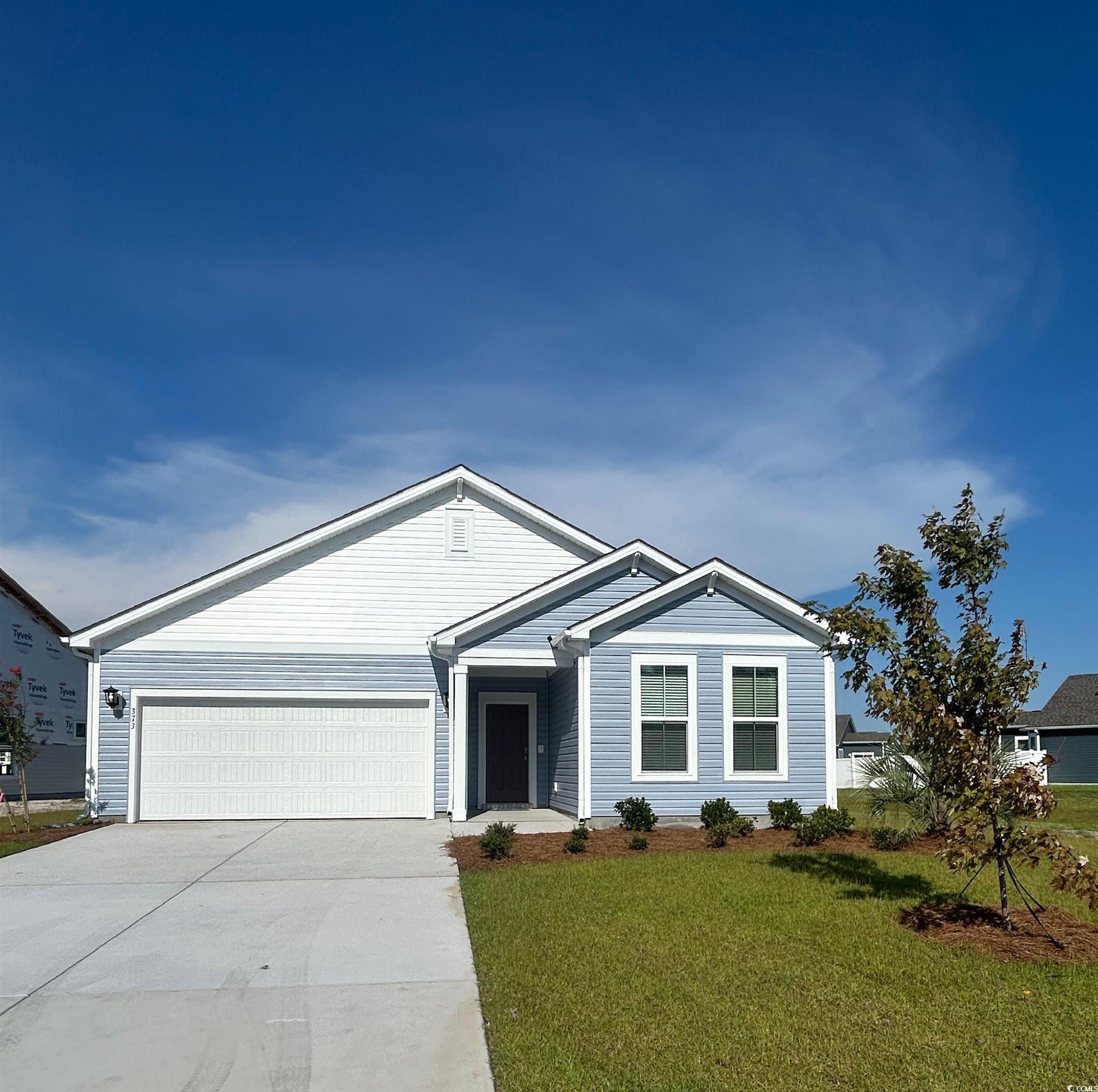 373 Kapalua Loop Little River, SC 29566 - Photo 1 of 9 Ranch-style home with a garage, driveway, and a fr