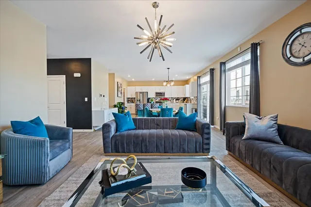 a living room with furniture ceiling fan and a rug