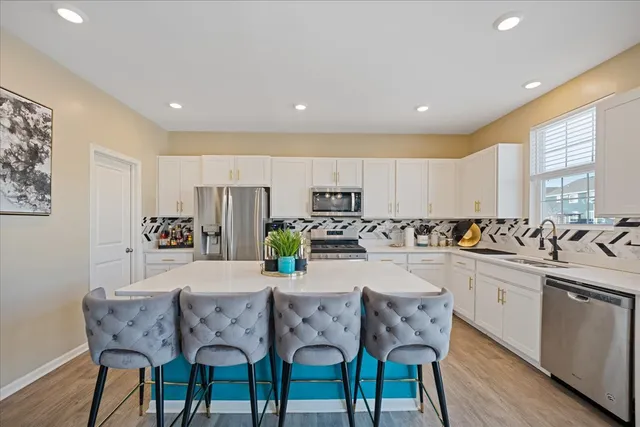 a dining room with furniture mountain view and a chandelier