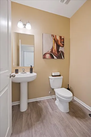 a living room with furniture potted plant and a window
