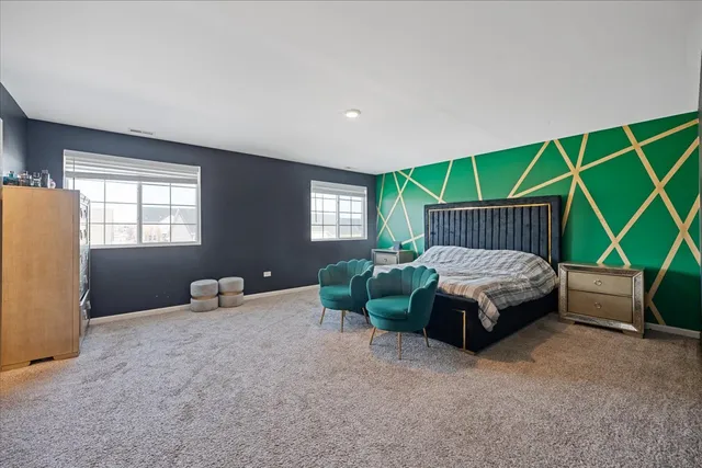 a bedroom with a bed and a television