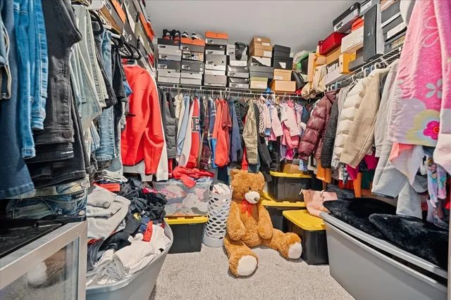 a spacious bathroom with a double vanity sink and a mirror