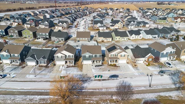 an aerial view of residential houses with outdoor space