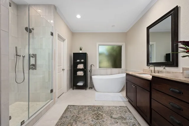 a bathroom with a tub sink and mirror