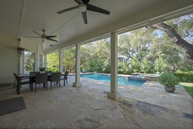 a view of swimming pool with a yard