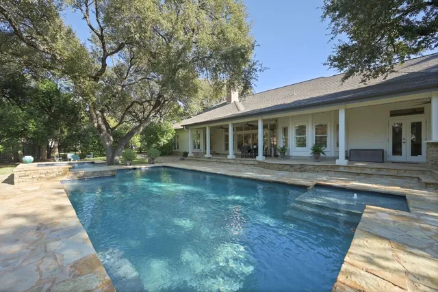 a front view of a house with swimming pool