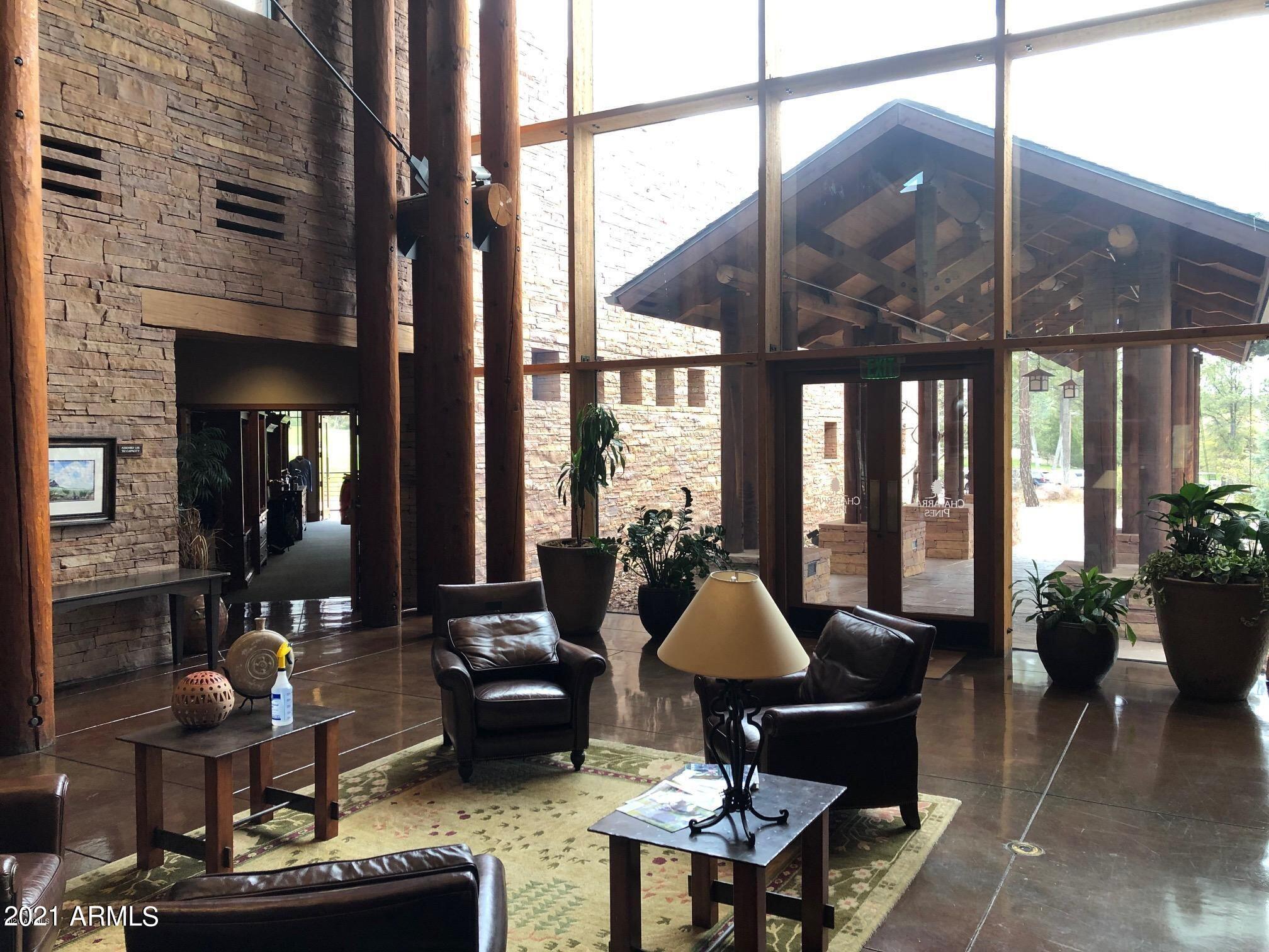 603 Club Drive, Unit 3 Payson, AZ 85541 - Photo 13 of 25 a living room filled with furniture and floor to ceiling windows
