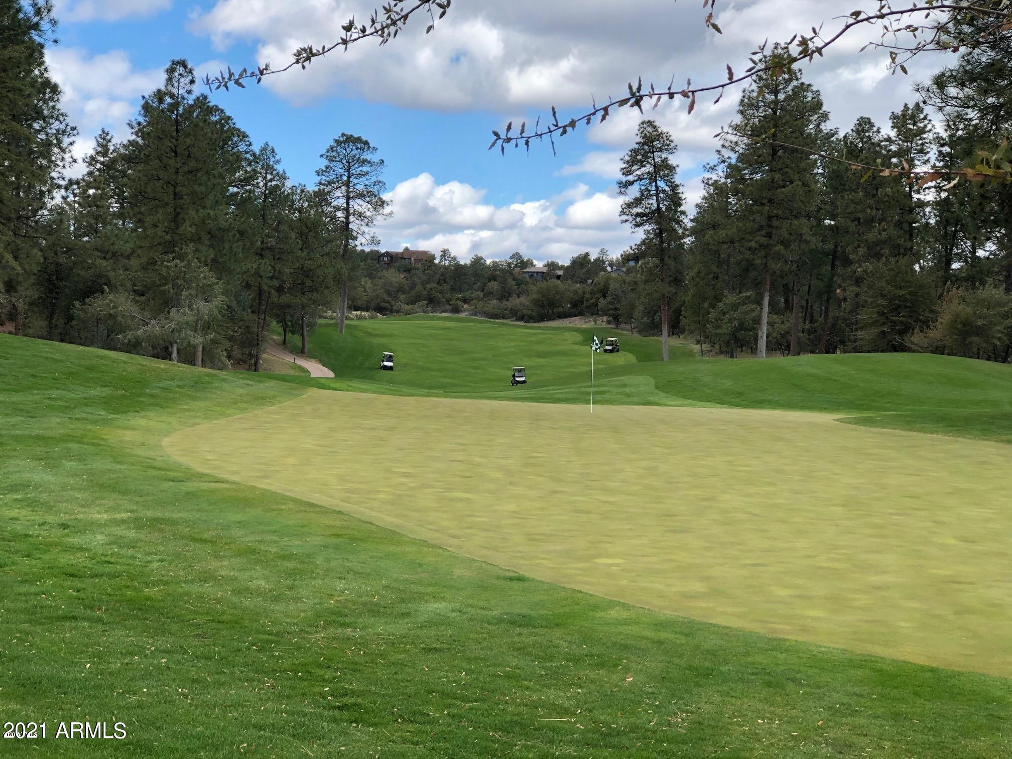 603 Club Drive, Unit 3 Payson, AZ 85541 - Photo 19 of 25 a view of a golf course with a lake