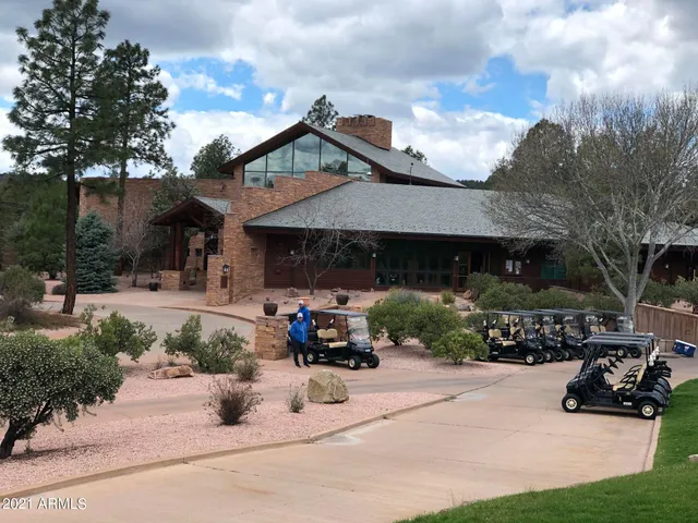 a view of a bench in the garden near a lake