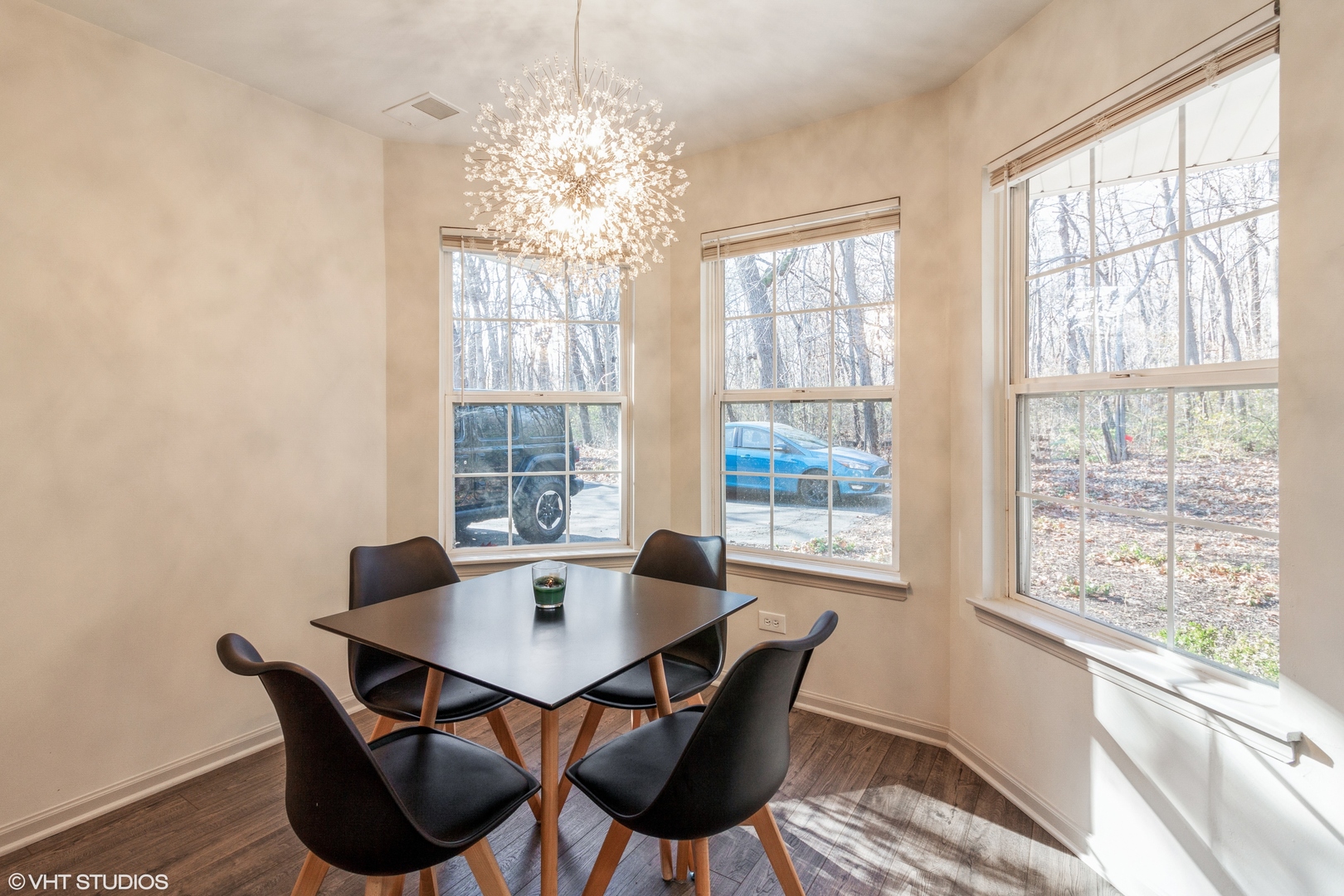 955 Elderberry Circle, Unit 111 Naperville, IL 60563 - Photo 5 of 11 a dining room with furniture a chandelier and wooden floor