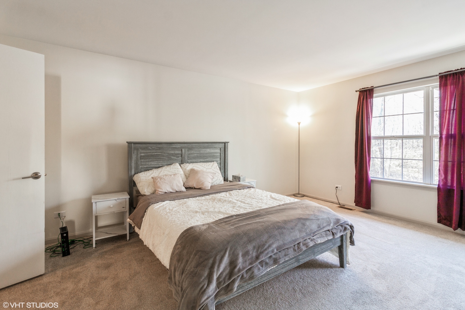 955 Elderberry Circle, Unit 111 Naperville, IL 60563 - Photo 7 of 11 a bedroom with a bed and a window