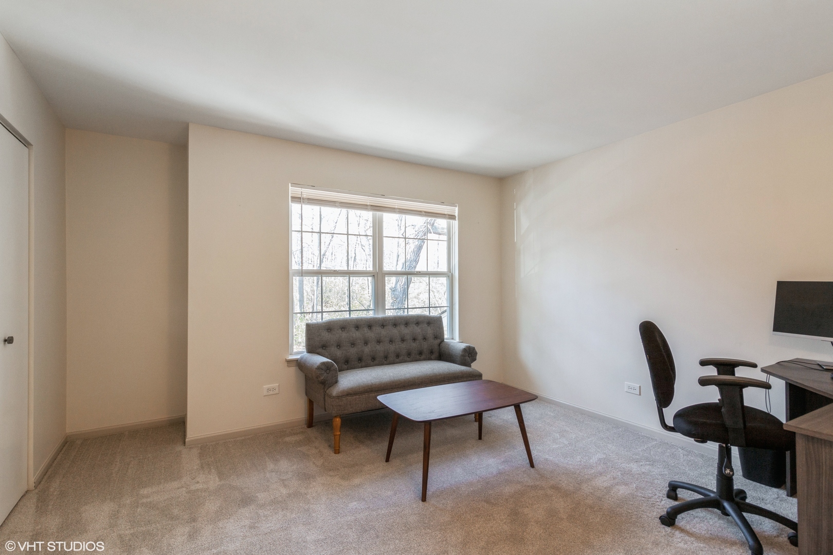 955 Elderberry Circle, Unit 111 Naperville, IL 60563 - Photo 8 of 11 a workspace with furniture and a window