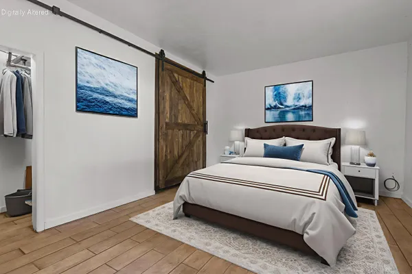 a large white bed in a white room