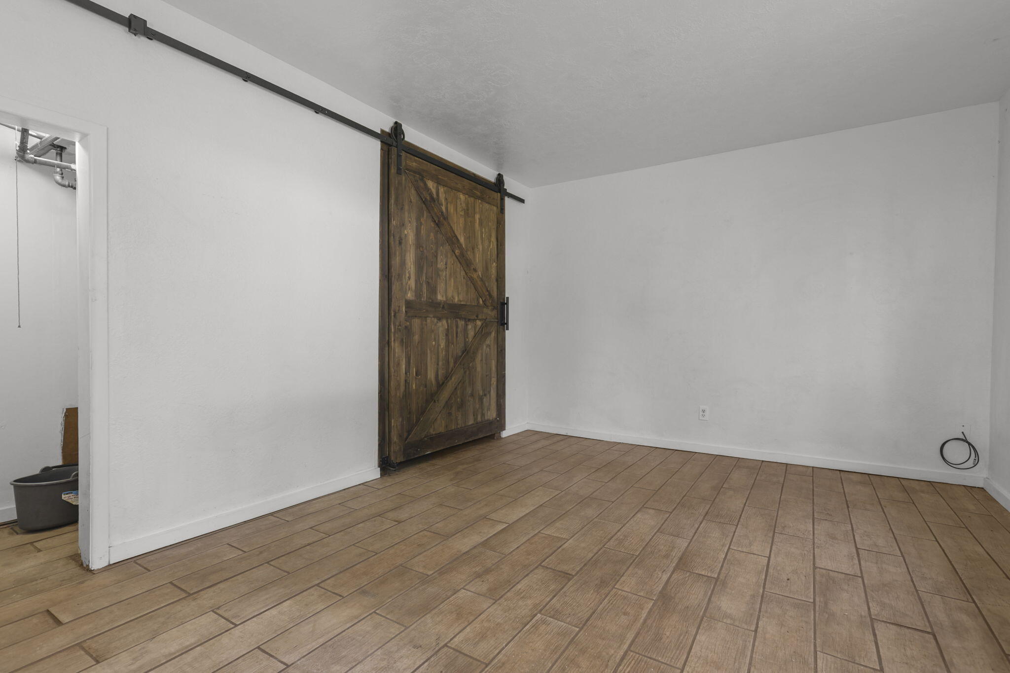 5040 Wilson Hill Road Manton, CA 96059 - Photo 13 of 37 a view of an empty room and wooden floor