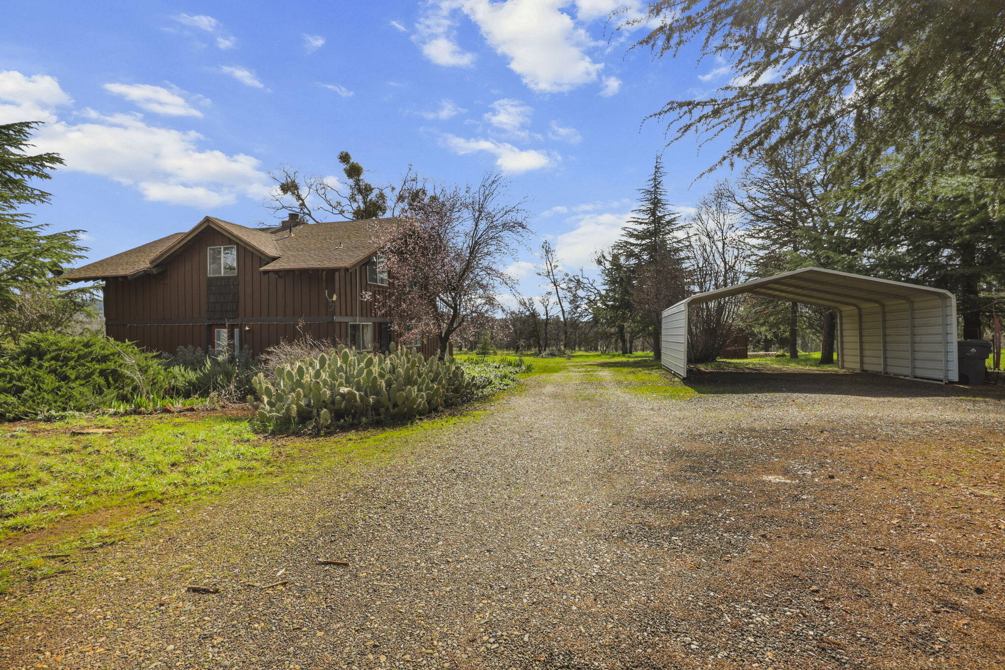 5040 Wilson Hill Road Manton, CA 96059 - Photo 33 of 37 a front view of a house with a yard and garage