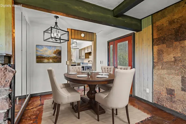a view of a dining room with furniture and window