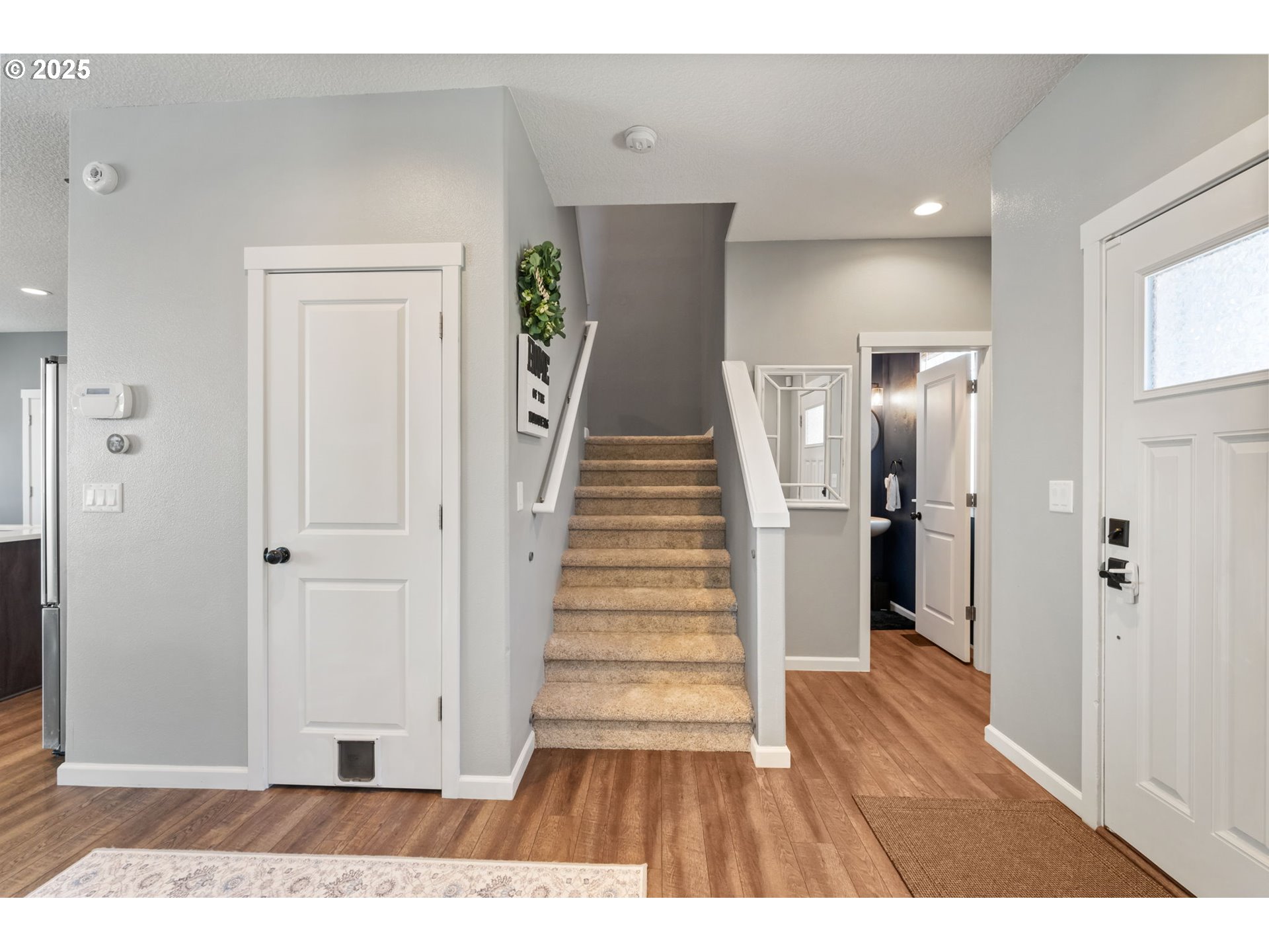 2820 Southeast Baker Avenue Gresham, OR 97080 - Photo 12 of 33 a view interior of house with wooden floor and stairs