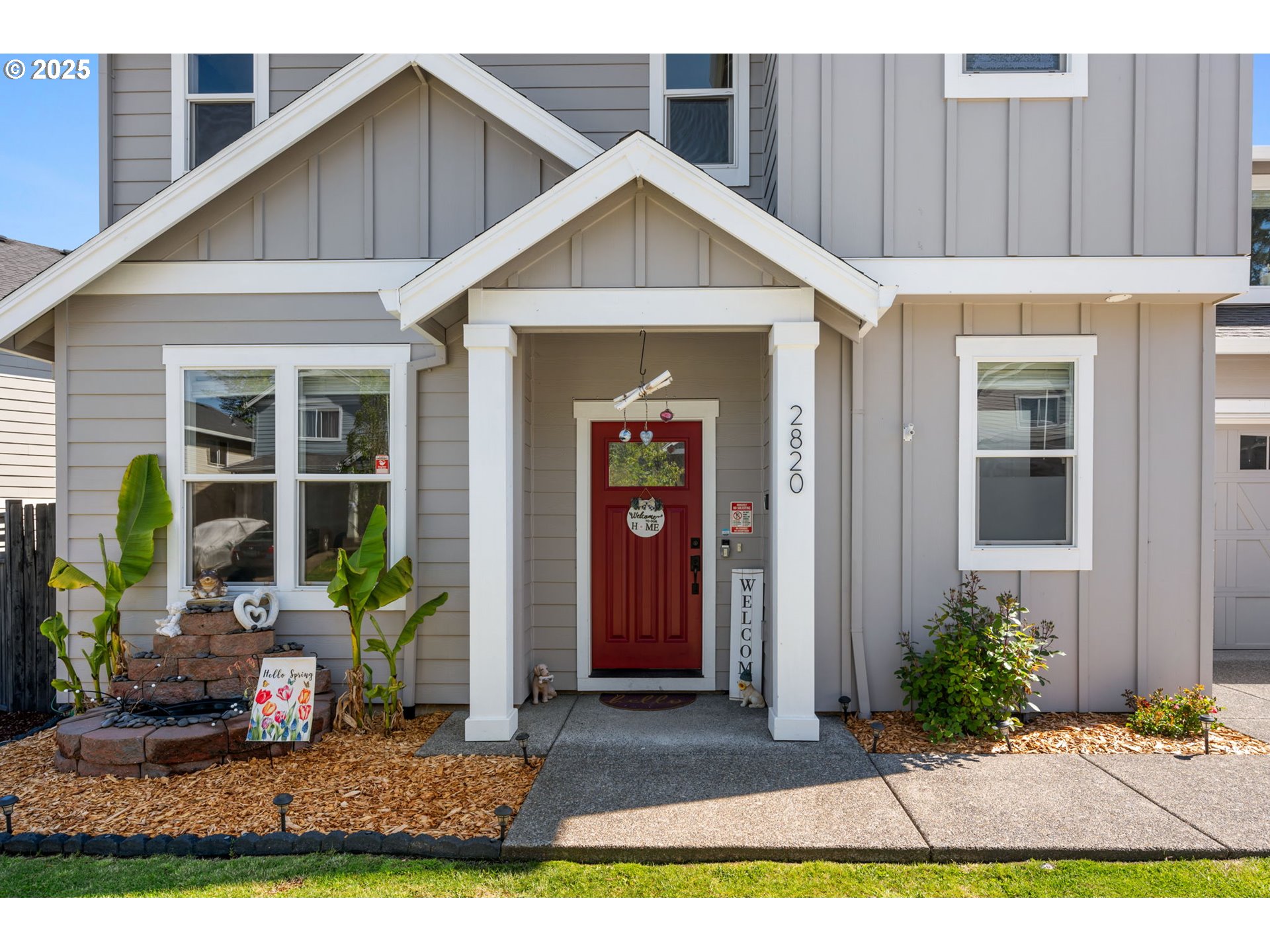 2820 Southeast Baker Avenue Gresham, OR 97080 - Photo 2 of 33 a view of a house with potted plants