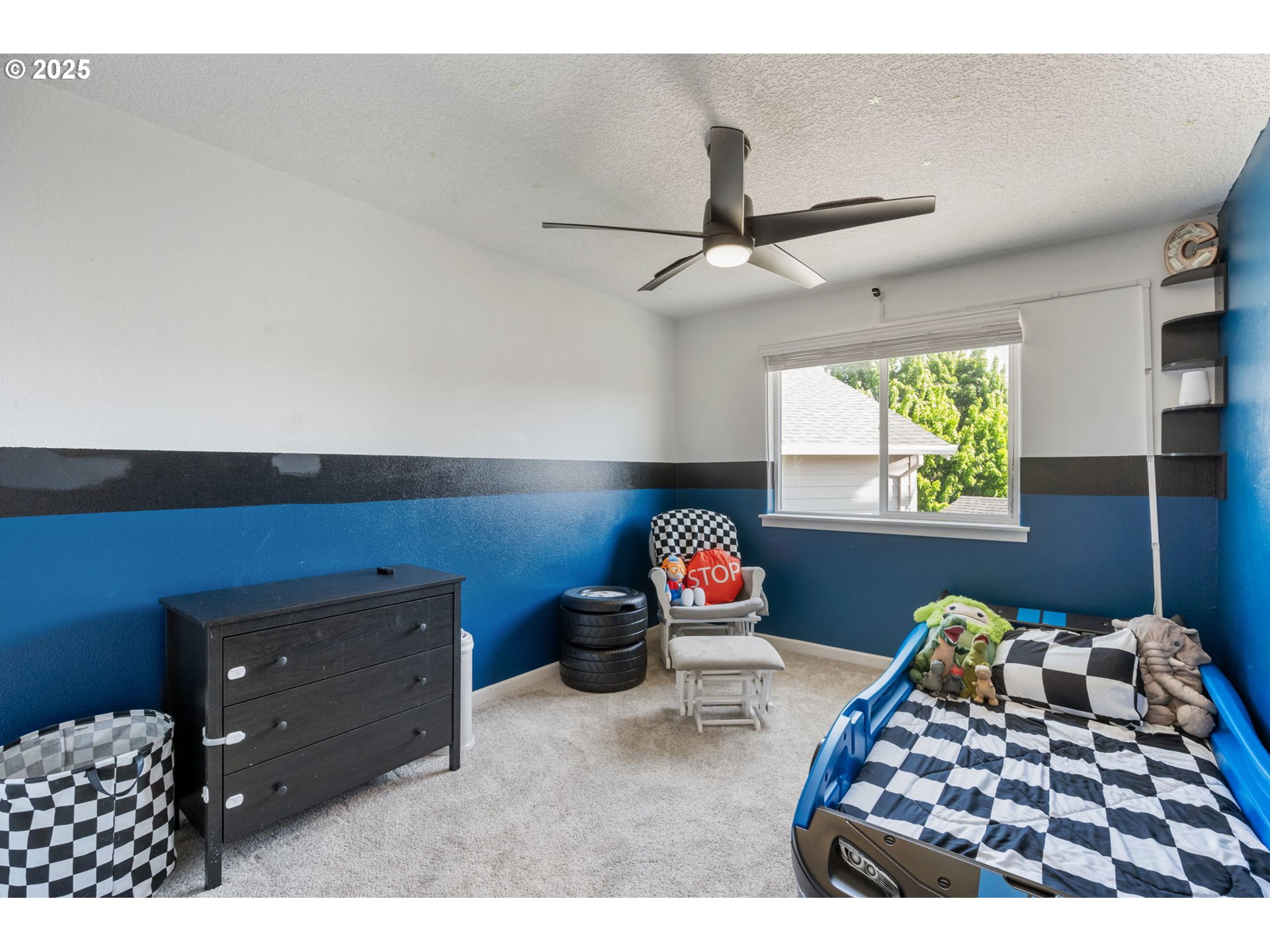 2820 Southeast Baker Avenue Gresham, OR 97080 - Photo 23 of 33 a bedroom with furniture and a chandelier
