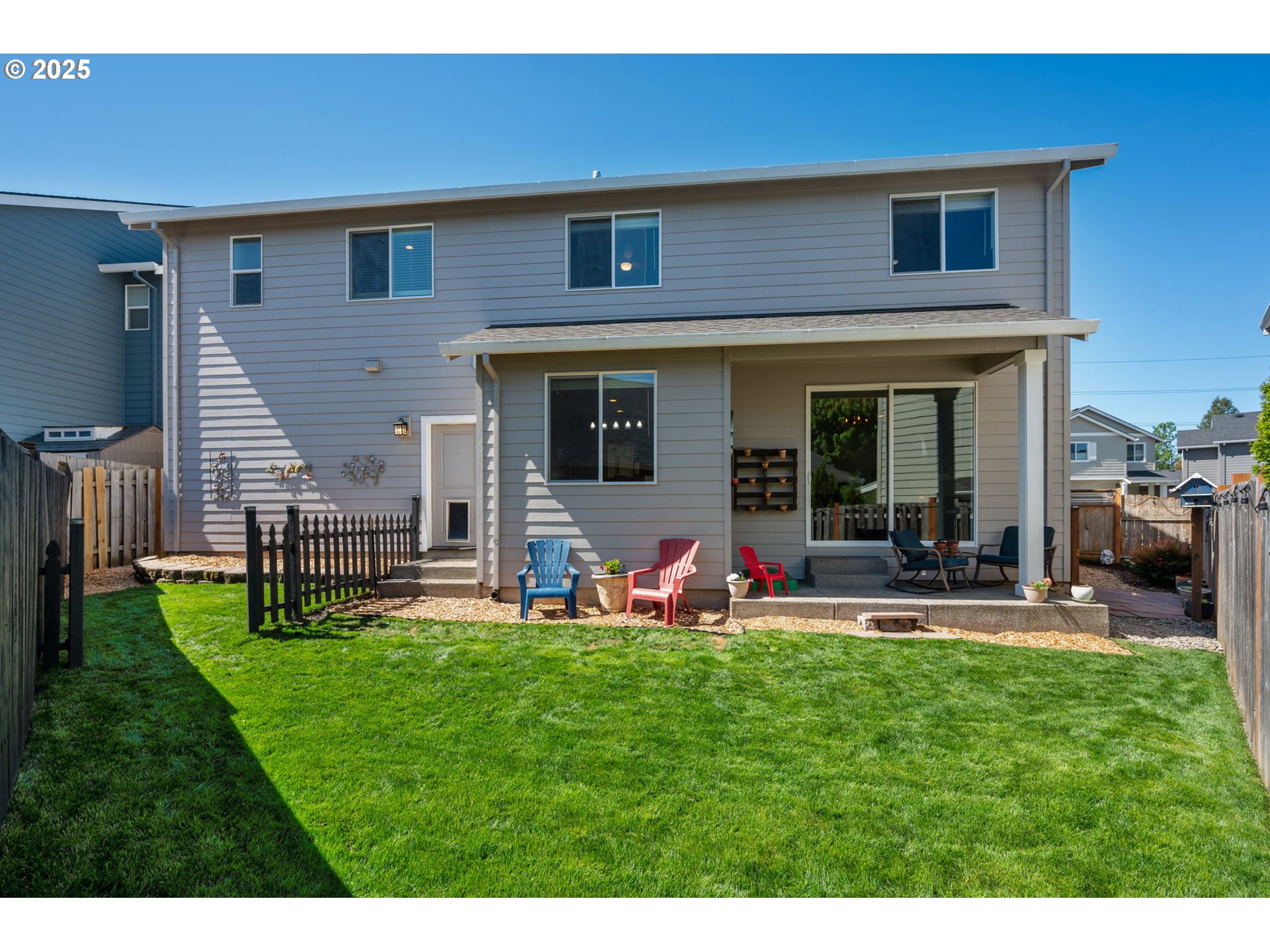 2820 Southeast Baker Avenue Gresham, OR 97080 - Photo 28 of 33 a front view of a house with a yard porch and sitting area
