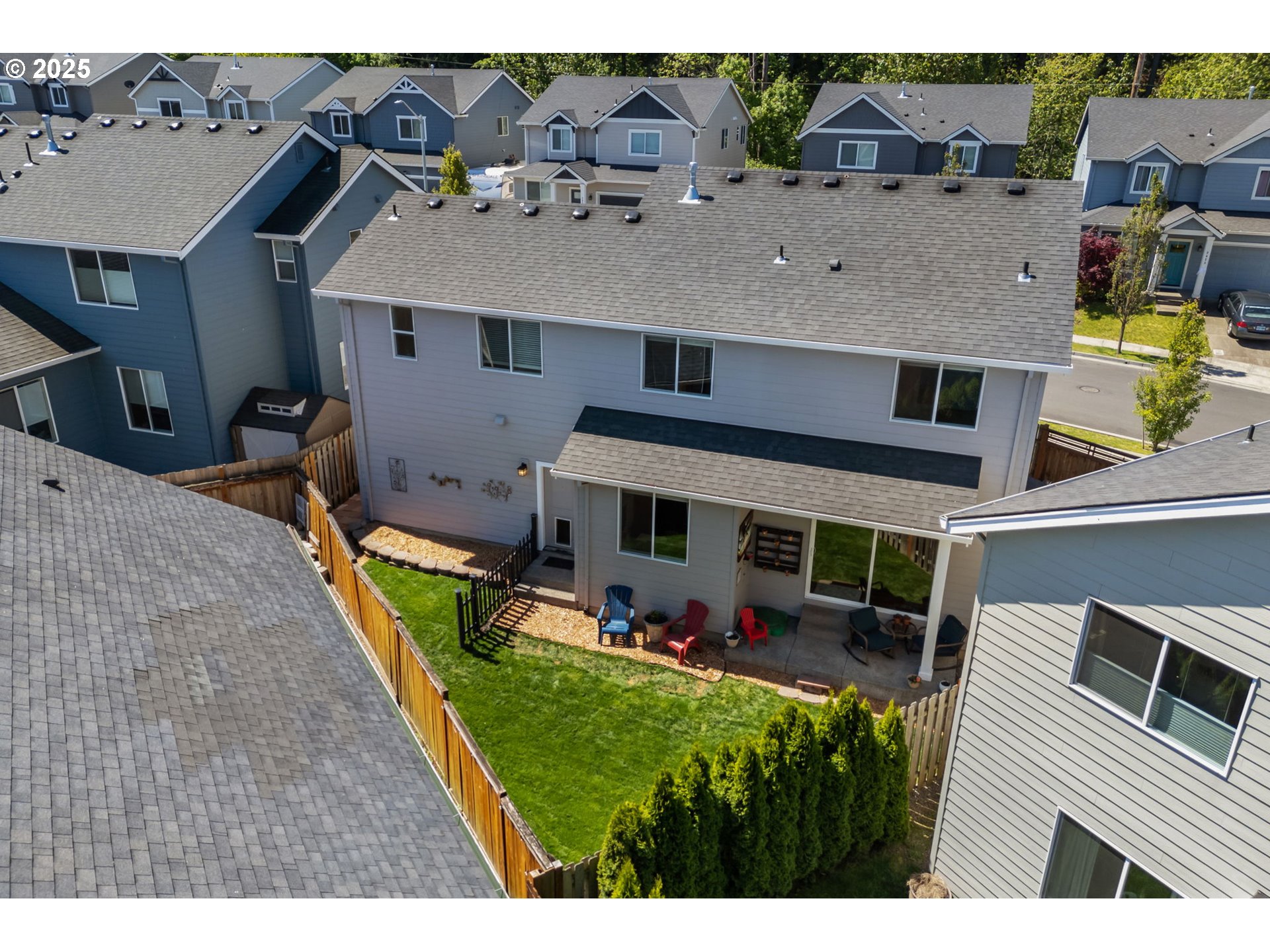 2820 Southeast Baker Avenue Gresham, OR 97080 - Photo 30 of 33 a view of a house with a backyard and a patio