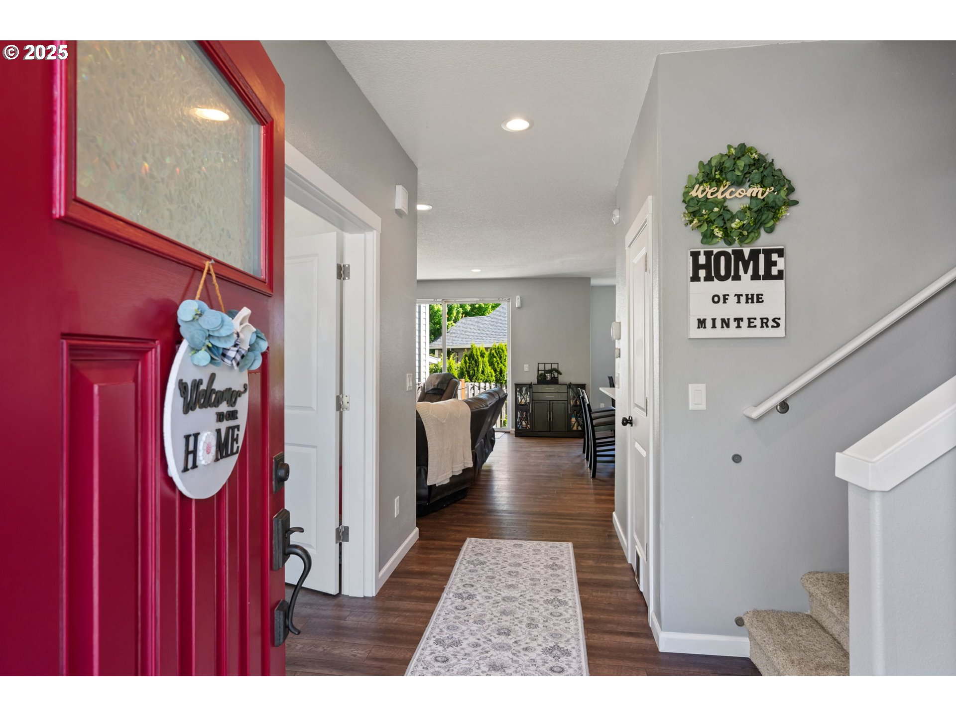 2820 Southeast Baker Avenue Gresham, OR 97080 - Photo 3 of 33 a hallway with painting on the wall and a window