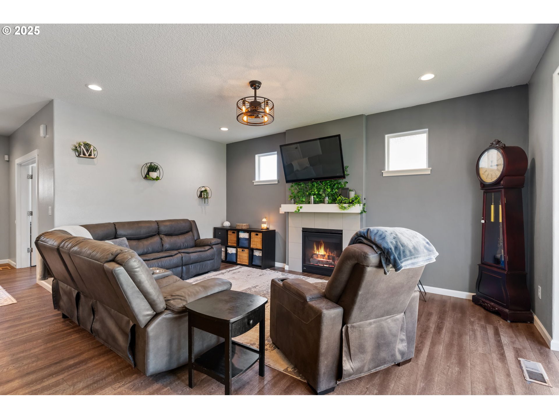 2820 Southeast Baker Avenue Gresham, OR 97080 - Photo 5 of 33 a living room with furniture a fireplace and a flat screen tv