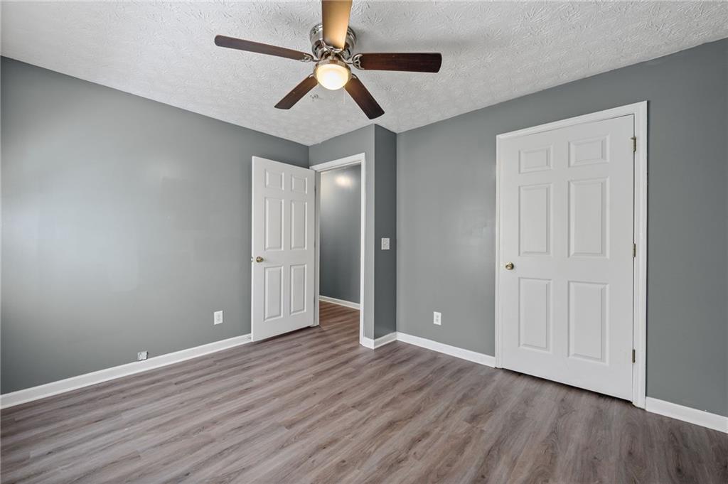 3303 Par 3 Way Lithonia, GA 30038 - Photo 15 of 27 an empty room with wooden floor and windows