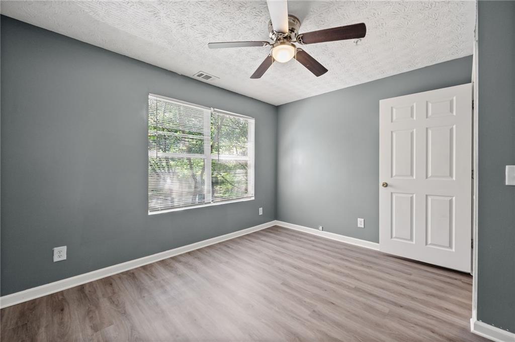 3303 Par 3 Way Lithonia, GA 30038 - Photo 16 of 27 a view of an empty room with a window